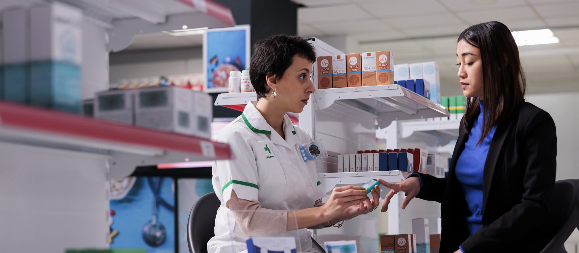 pharmacist talking to woman