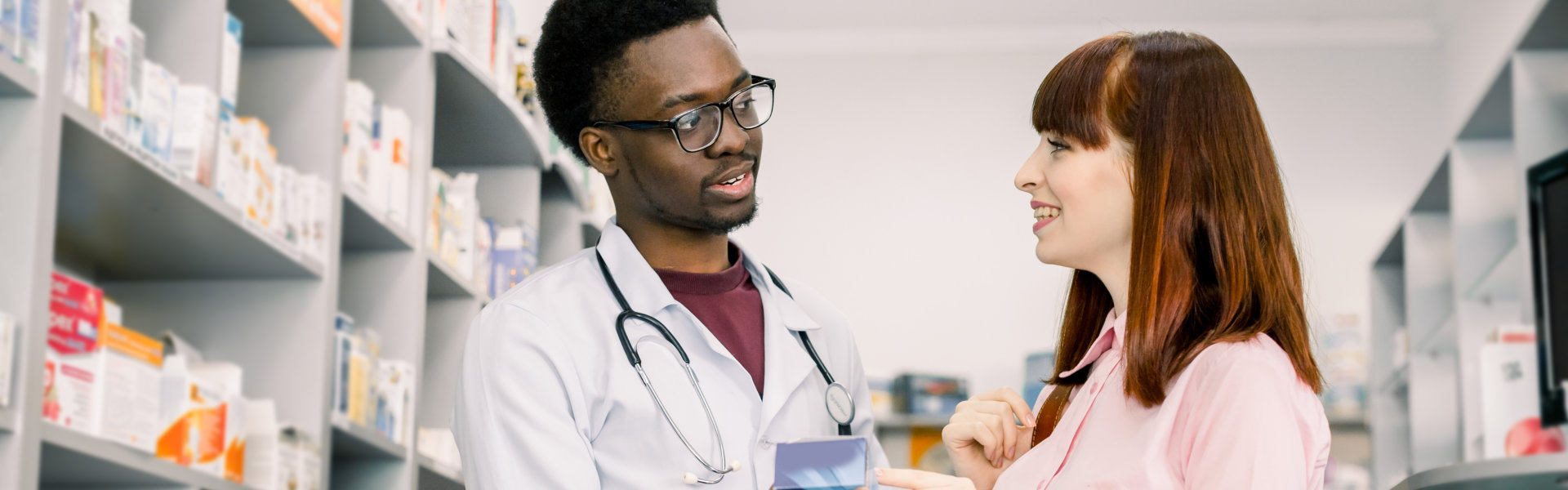 pharmacist talking to woman