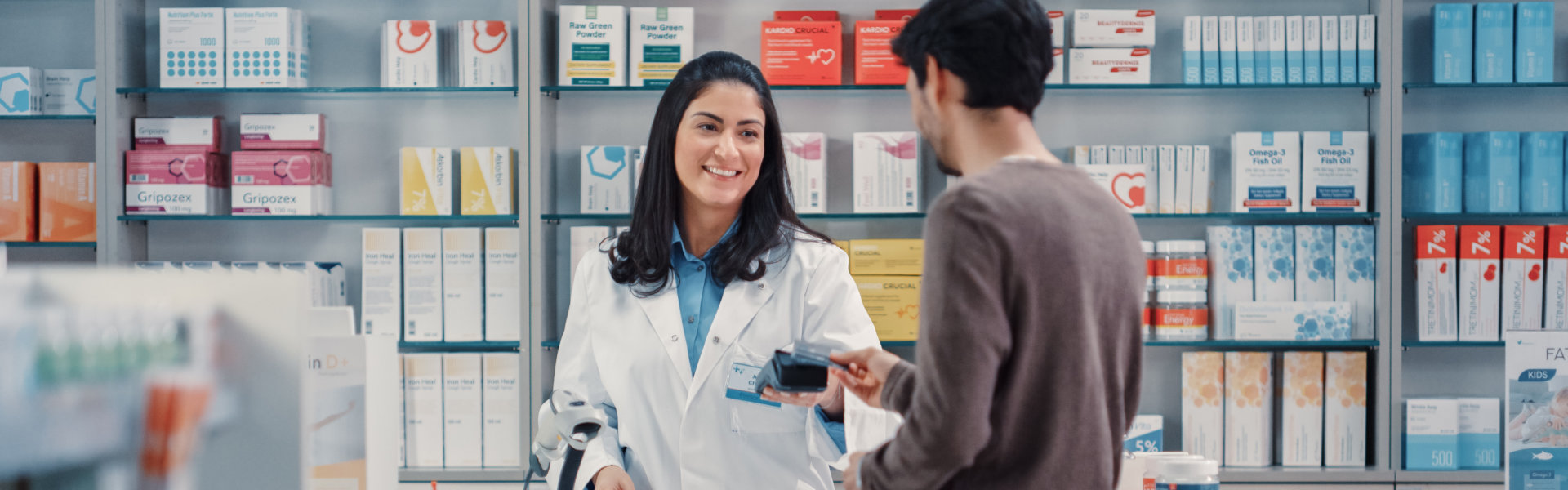 pharmacist and young man transacting